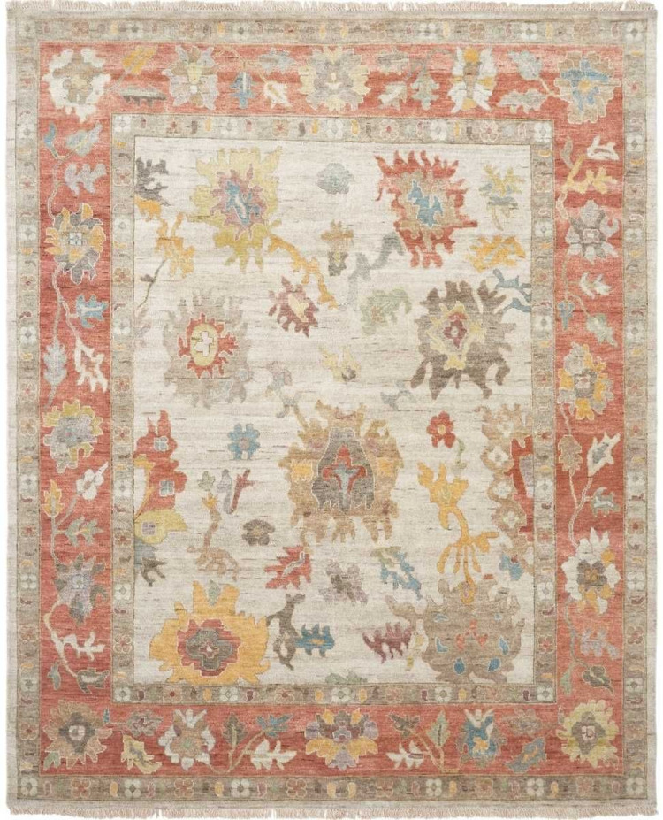 Traditional oriental rug with a luminous cream parchment field and a wide terracotta spice-colored floral border, featuring large floral palmettes in blue, yellow, and sage.
