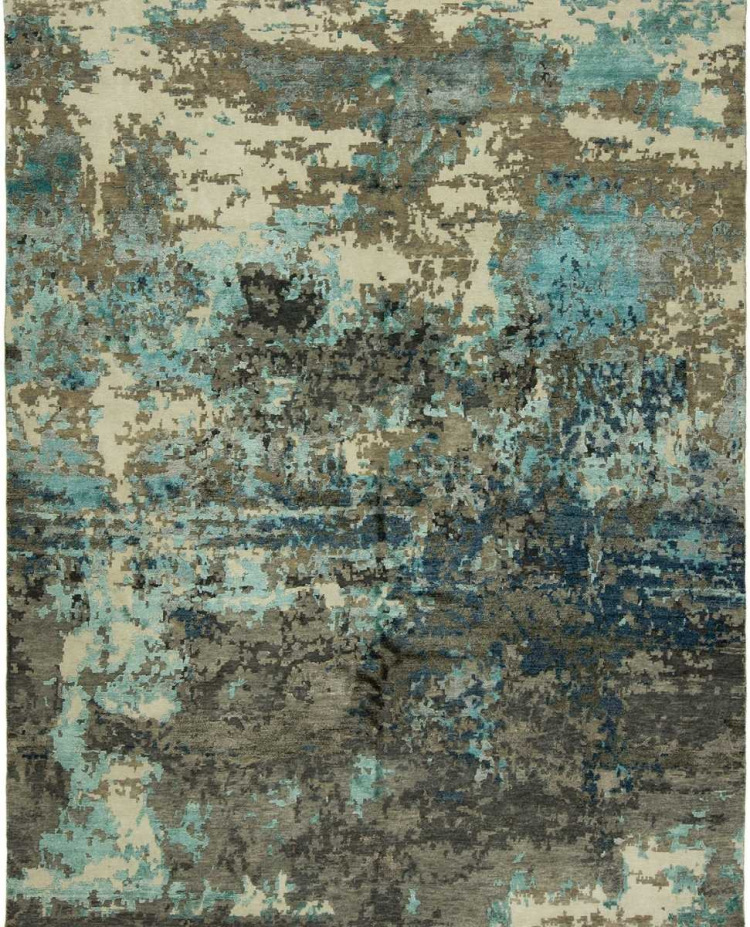 Modern abstract area rug with a distressed, weathered texture in a neutral palette of cream, taupe, and charcoal gray.