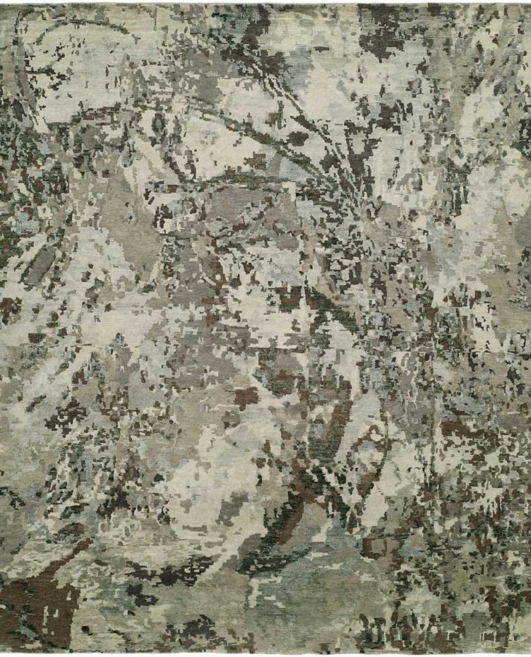 Neutral abstract area rug with a distressed texture in a palette of cream, taupe, and charcoal gray.