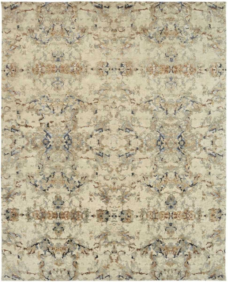 Intricate, muted neutral patterned area rug with distressed beige and brown tones.